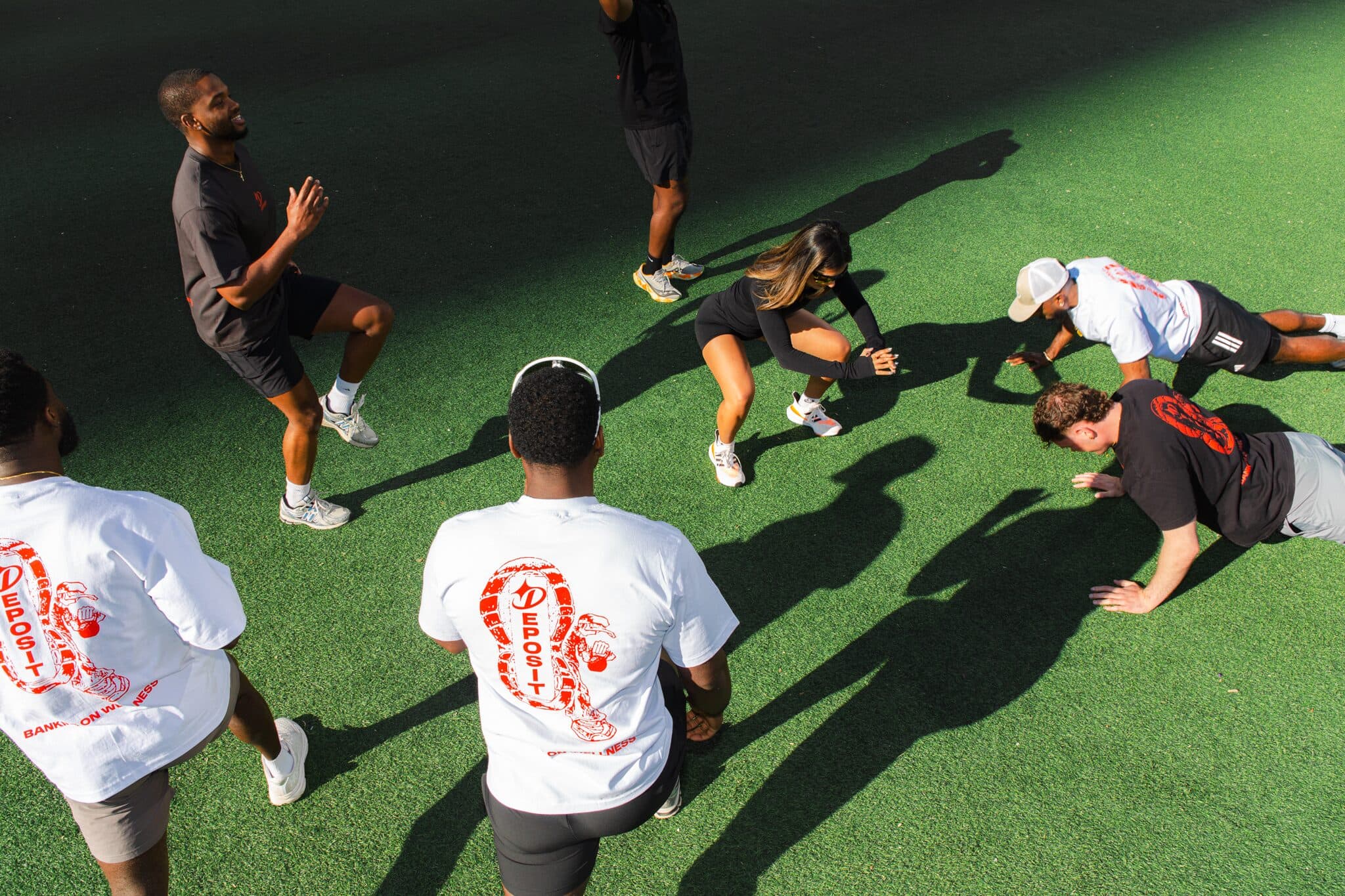 Group warmup circle on turf.